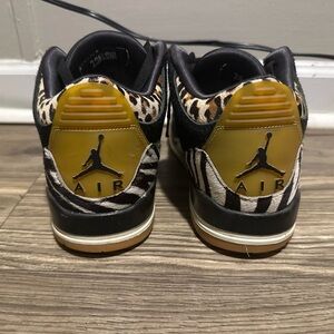 Black and Gold Jordan Athletic Shoes with Retro Silhouette